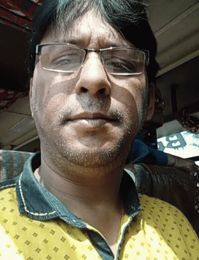 Man In Glasses And Yellow Patterned Shirt GIF