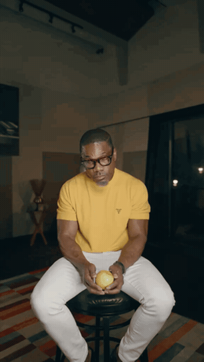 Man In Glasses And Yellow Shirt Holding Apple GIF