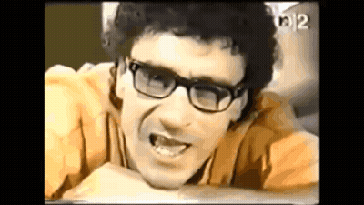 Man In Glasses And Yellow Shirt With Number 12 GIF