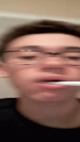Man In Glasses Brushing Teeth GIF