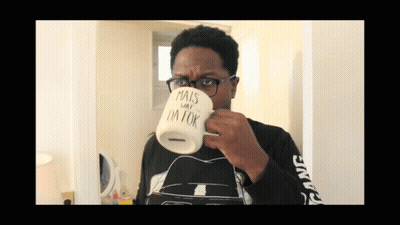 Man In Glasses Drinking From Mug Saying Mais Day I'm Ok GIF