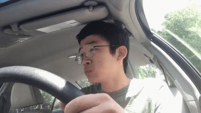 Man In Glasses Driving Car With Sun Visor GIF