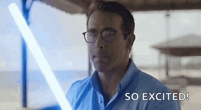 Man In Glasses Holding Lightsaber GIF
