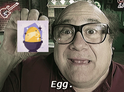 Man In Glasses Holding Picture Of Egg With Word Egg GIF