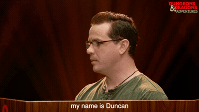 Man In Glasses In Front Of My Name Is Duncan Sign GIF