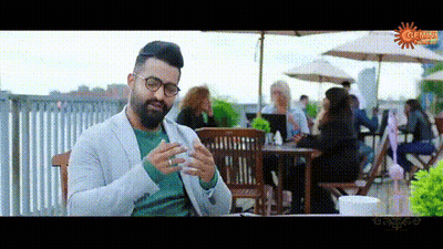 Man In Glasses Lying In Bed On Phone GIF