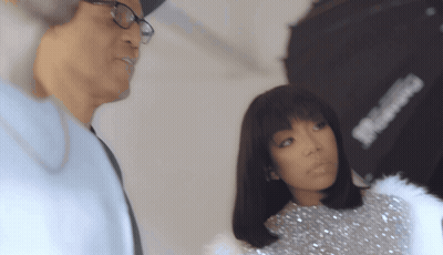 Man in Glasses Next to Woman in Sequined Top