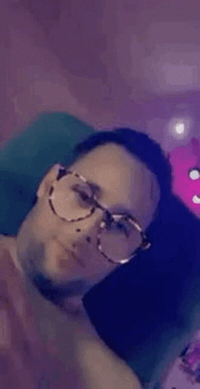 Man In Glasses On Couch Smiling GIF