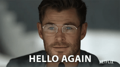 Man In Glasses Saying Hello Again On Netflix Screen GIF