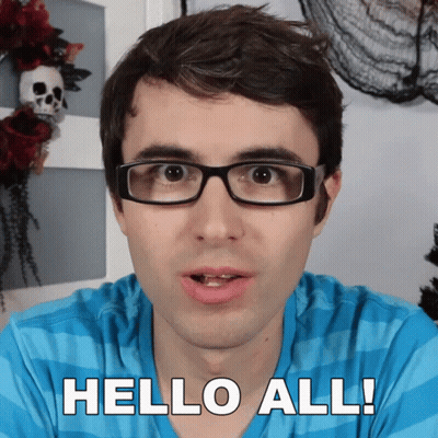 Man In Glasses Saying Hello All In Front Of Skull Wreath GIF
