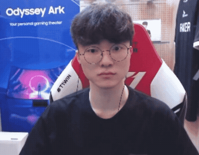 Man In Glasses Sitting In Front Of Odyssey Ark Sign GIF