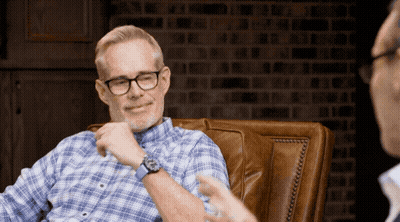 Man In Glasses Sitting With Another Man GIF