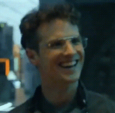 Man In Glasses Smiling Blurry Photo GIF