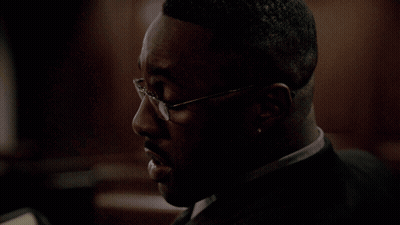 Man In Glasses Talking To Woman In Living Room GIF