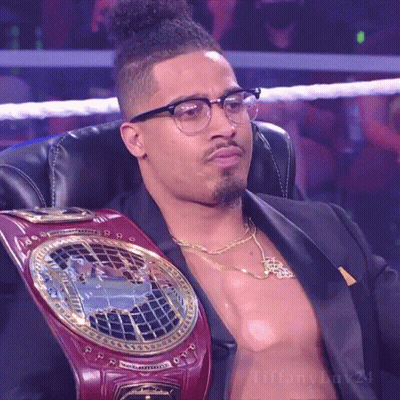 Man In Glasses With Heavyweight Championship Belt Sitting GIF