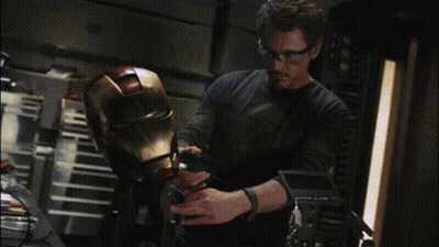 Man In Glasses Working On Iron Man Helmet GIF
