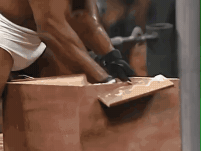 Man In Gloves Lifting Large Brown Box GIF