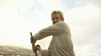 Man In Gloves Swinging Hammer GIF