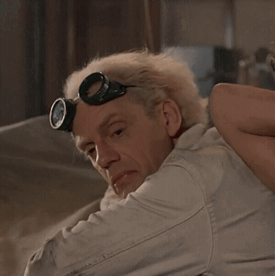 Man In Goggles Looking Over Shoulder GIF