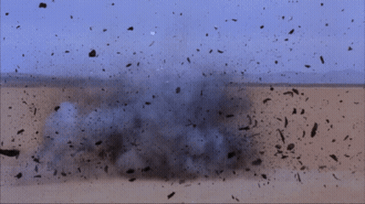 Man In Gold Helmet In Desert GIF