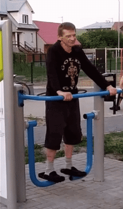 Man In Gold S Gym Shirt Exercising On Machine GIF