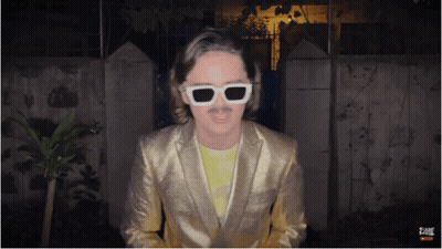 Man In Gold Suit And White Sunglasses GIF