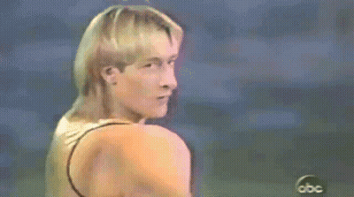 Man In Gold Tank Top In Front Of ABC Logo GIF