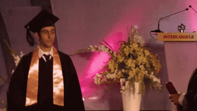 Man In Graduation Cap And Gown GIF