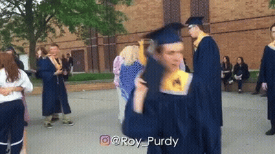 Man In Graduation Cap And Gown Holding Diploma GIF