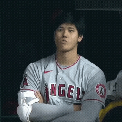 Man In Gray Angels Jersey With Arms Crossed GIF