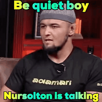 Man In Gray Hat And Black Shirt Be Quiet Boy Nursolton Is Talking GIF