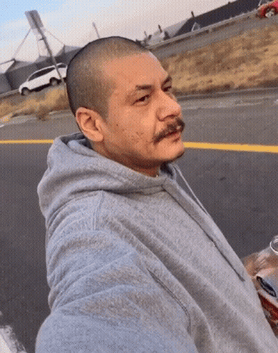 Man In Gray Hoodie Taking Selfie Holding Soda GIF