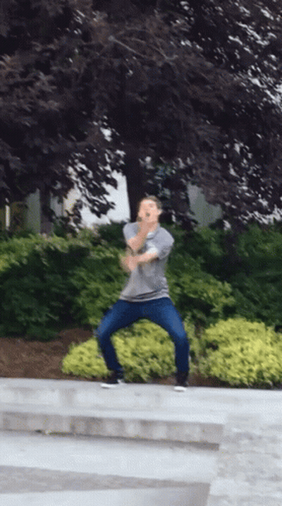 Man In Gray Shirt And Blue Jeans Dancing GIF