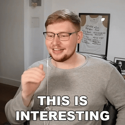 Man In Gray Shirt And Glasses Says This Is Interesting GIF
