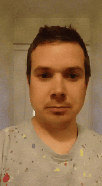 Man In Gray Shirt Making Funny Face GIF