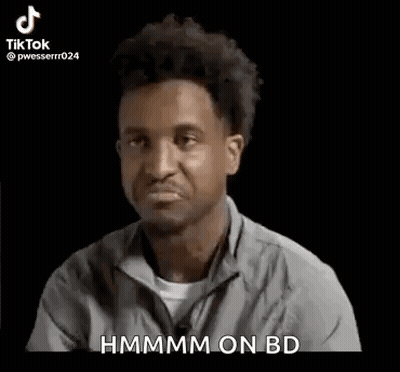 Man In Gray Shirt Making Funny Face Saying Hmm On BD GIF