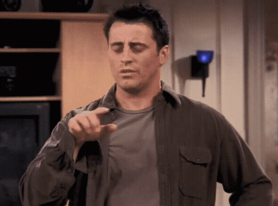 Man In Gray Shirt Pointing At Camera GIF