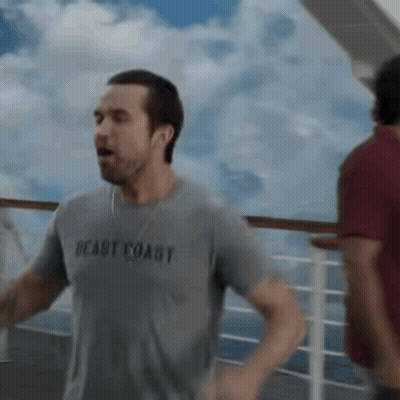 Man In Gray Shirt Saying Beast Coast Running On Cruise Ship GIF