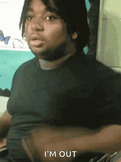 Man In Gray Shirt Sitting With Arms Crossed Says Yup GIF