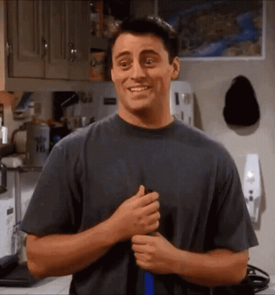 Man In Gray Shirt Smiling In Kitchen GIF
