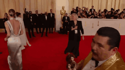 Man In Gray Sweatshirt And Blue Pants Standing In Park GIF
