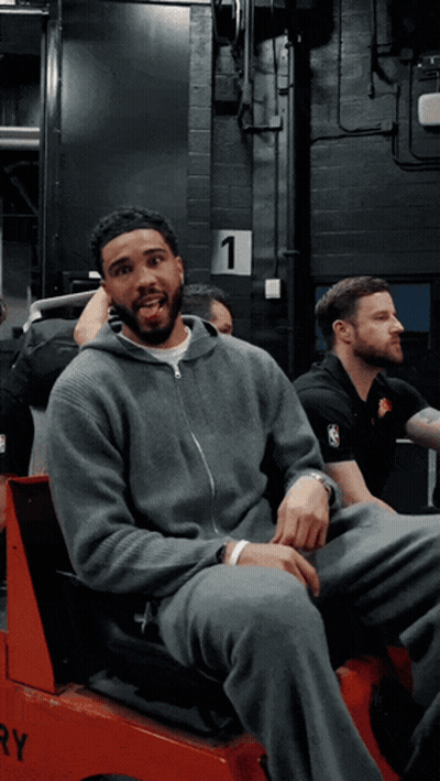 Man In Gray Sweatshirt In Red Vehicle Number 1 GIF