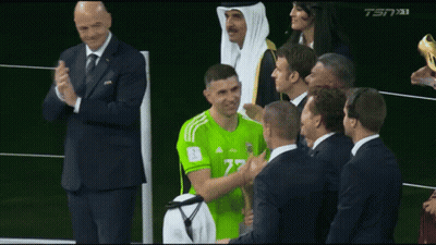 Man In Green Adidas Jersey Congratulated By Group GIF
