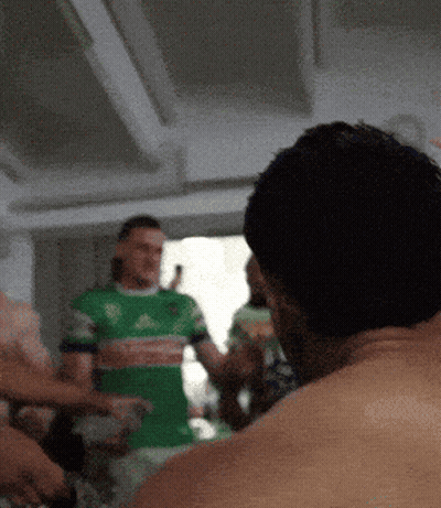 Man In Green Adidas Shirt Standing GIF