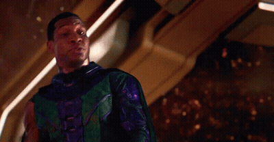 Man In Green And Purple Superhero Costume GIF