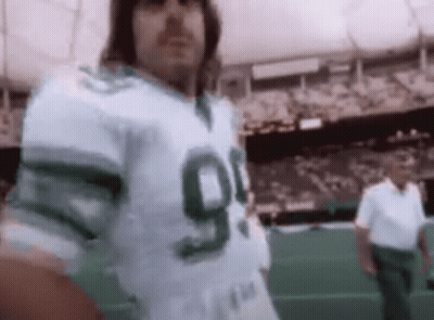 Man In Green And White Football Jersey Number 90 GIF