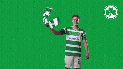 Man In Green And White Hofmann Shirt Holding Scarf GIF