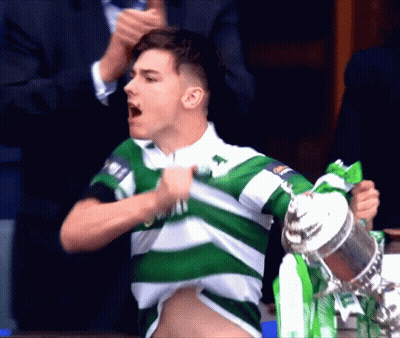 Man In Green And White Striped Shirt Holding Trophy GIF