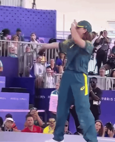 Man In Green And Yellow Asics Jersey Dancing GIF
