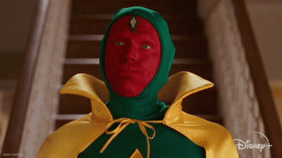 Man In Green And Yellow Cape With Red Paint Saying Yes GIF